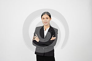 Young motivated businesswoman standing with her arms crossed with white isolated background