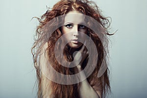 Portrait of a young beautiful redheaded woman