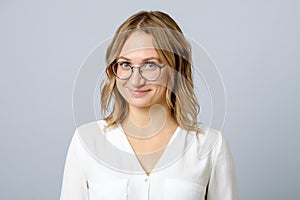 Portrait of young beautiful shy girl smiling