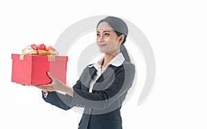 Portrait young beautiful smiling happy woman wear black suit  holding red gift box looking at camera on isolated white background