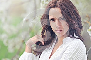 Portrait of the young beautiful smiling woman outdoors