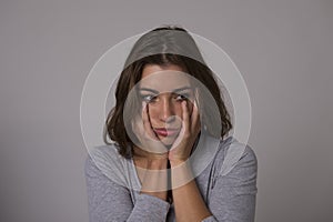 Portrait of young beautiful and sweet woman looking sad and devastated in sadness emotion