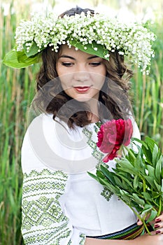 Portrait of a young beautiful in traditional Ukrainian shirt