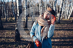 Portrait of young beautiful woman in autumn blye coat. Fashion photo