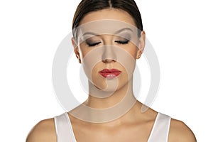 Portrait of a young beautiful woman with closed eyes and makeup