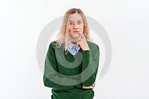 Portrait of Young beautiful woman with fair-haired, lost in thought, standing thoughtful, choosing, thinking, wears casual clothes