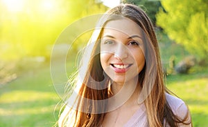 Portrait of young beautiful woman on green background spring summer nature