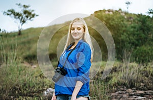 Portrait of young beautiful woman happy and smiling while standing at outdoor,Travel nature concept