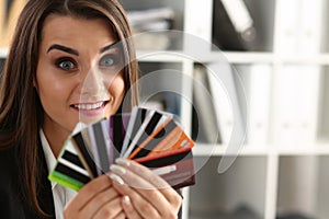 Portrait of young beautiful woman holding bank plastic credit cards