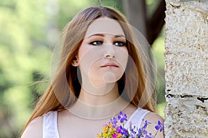 Young woman with wildflowers