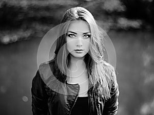 Portrait of young beautiful woman in leather jacket