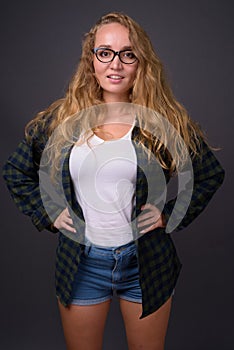 Portrait of young beautiful woman with long wavy blond hair