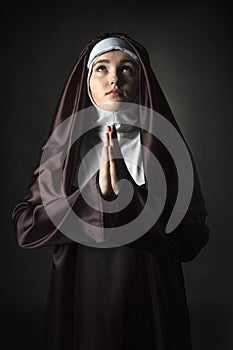 Portrait of young beautiful woman nun