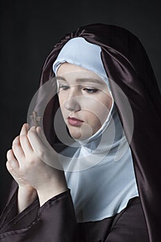 Portrait of young beautiful woman nun