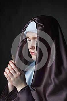 Portrait of young beautiful woman nun