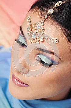 Portrait of young beautiful woman in oriental style