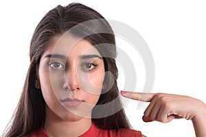 Portrait of young beautiful woman pointing at her self photo