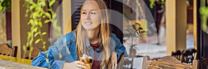 Portrait of young beautiful woman sitting in a cafe outdoor drinking coffee BANNER, LONG FORMAT