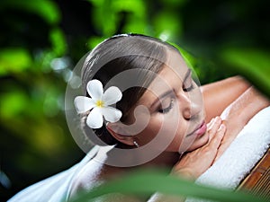 Portrait of young beautiful woman in spa