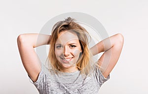 Portrait of a young beautiful woman in studio on a white background.