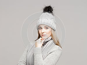 Portrait of a young and beautiful woman in a winter hat