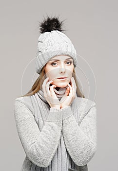 Portrait of a young and beautiful woman in a winter hat