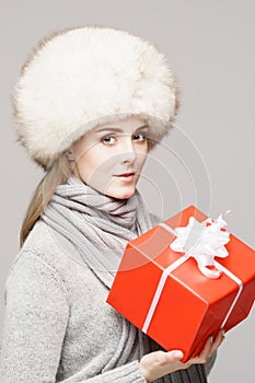 Portrait of a young and beautiful woman in a winter hat