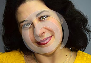 Portrait of the young beautiful woman.  Woman has green eyes, red lips and black hair