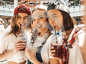 Portrait of young beautiful women posing outdoors