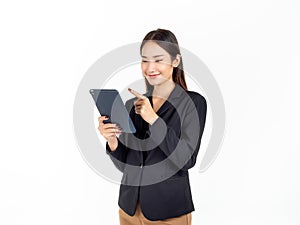 Portrait of young beauty Asian Businesswoman in black suit holding and using tablet