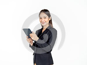Portrait of young beauty Asian Businesswoman in black suit holding and using tablet