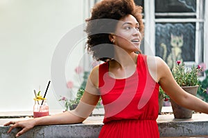Portrait of a young black woman, model of fashion wearing dress with afro hairstyle