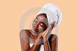 Portrait of young black woman napping, pretending sleeping