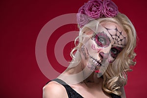 Portrait of young blond girl with Calaveras makeup