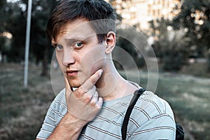 Portrait of a young blue eyed men in the Park