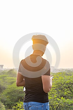 Portrait of a young boy in bright sunlight