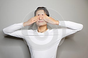 Portrait of young boy with closed eyes; studio shot