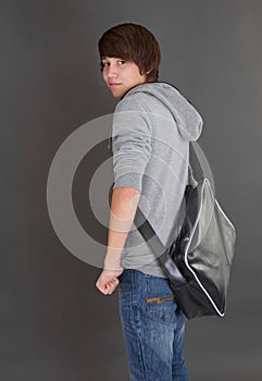 Portrait of young boy with his bag.