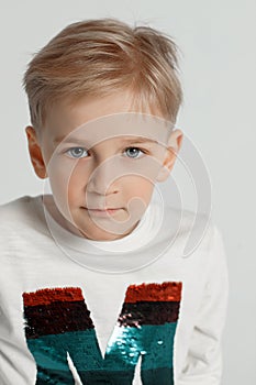 Portrait of a young boy light background