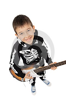 Portrait of young boy playing electric guitar, isolated on white. Boy playing the guitar