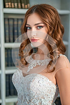 Portrait of a young bride , beautiful make-up and curls