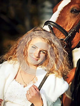 Portrait of young bride with her horse