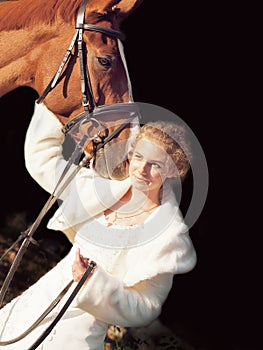 Portrait of young bride with her horse