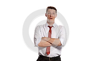 Portrait of a young brunet man posing in a studio isolated over a white background.