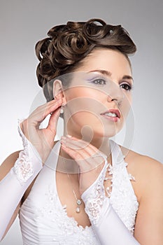 Portrait of a young brunette bride in makeup