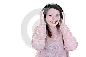 Portrait of young brunette smiling woman with headphones aside copy space
