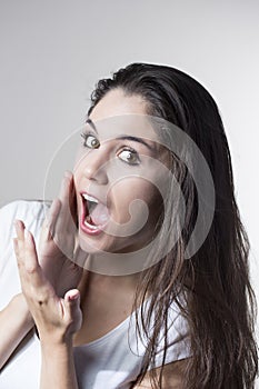 Portrait of a young brunette woman making faces