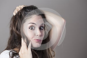 Portrait of a young brunette woman making faces
