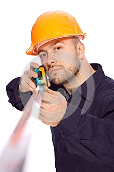 Portrait of a young builder with the tools