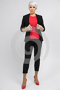 Portrait of young buisness lady in costumes isolated on background